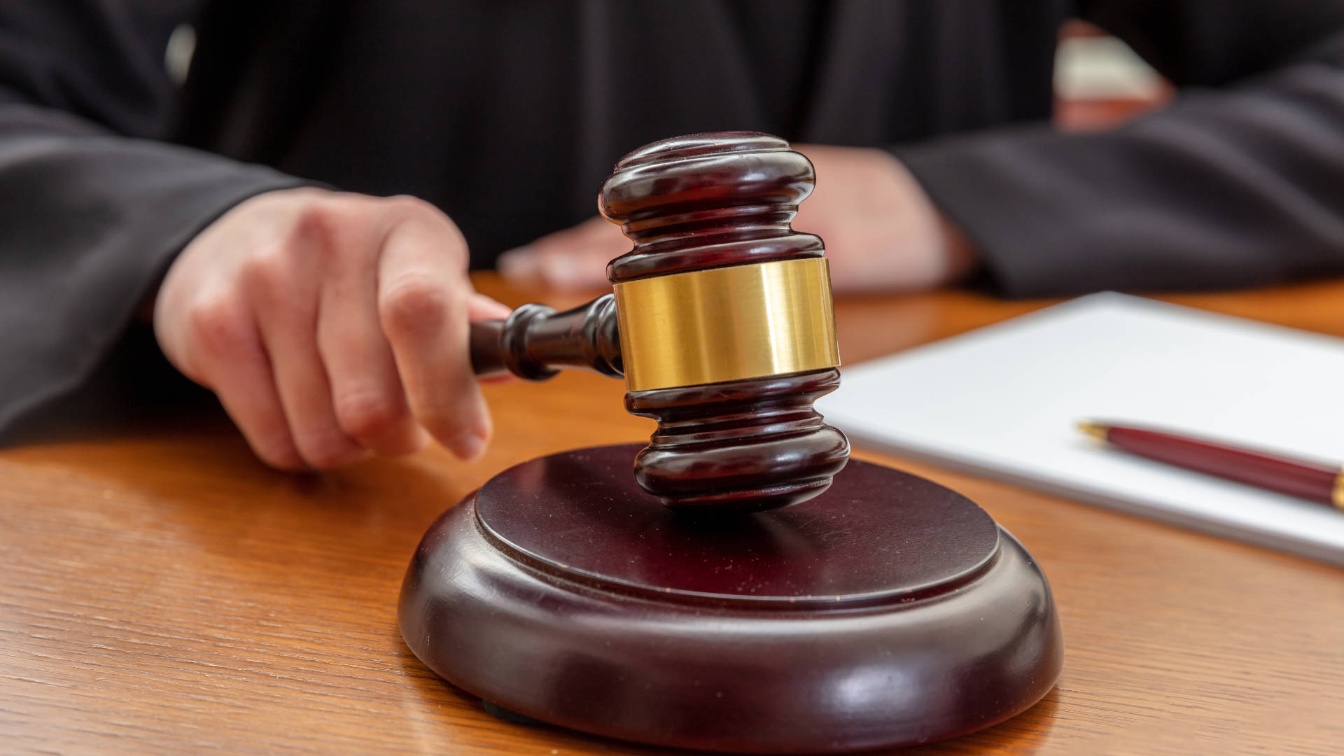 Gavel hammering a sentence